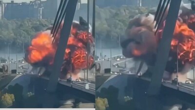 A Russian drone strike hits a bridge in Kyiv as vehicles cross the damaged structure. (Photo: video screengrab)