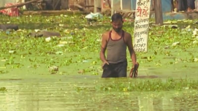 Waterlogging continues across several parts of Faizullaganj, with residents forced to wade through waist- or chest-deep water to reach safer areas or collect essential supplies. (PTI)