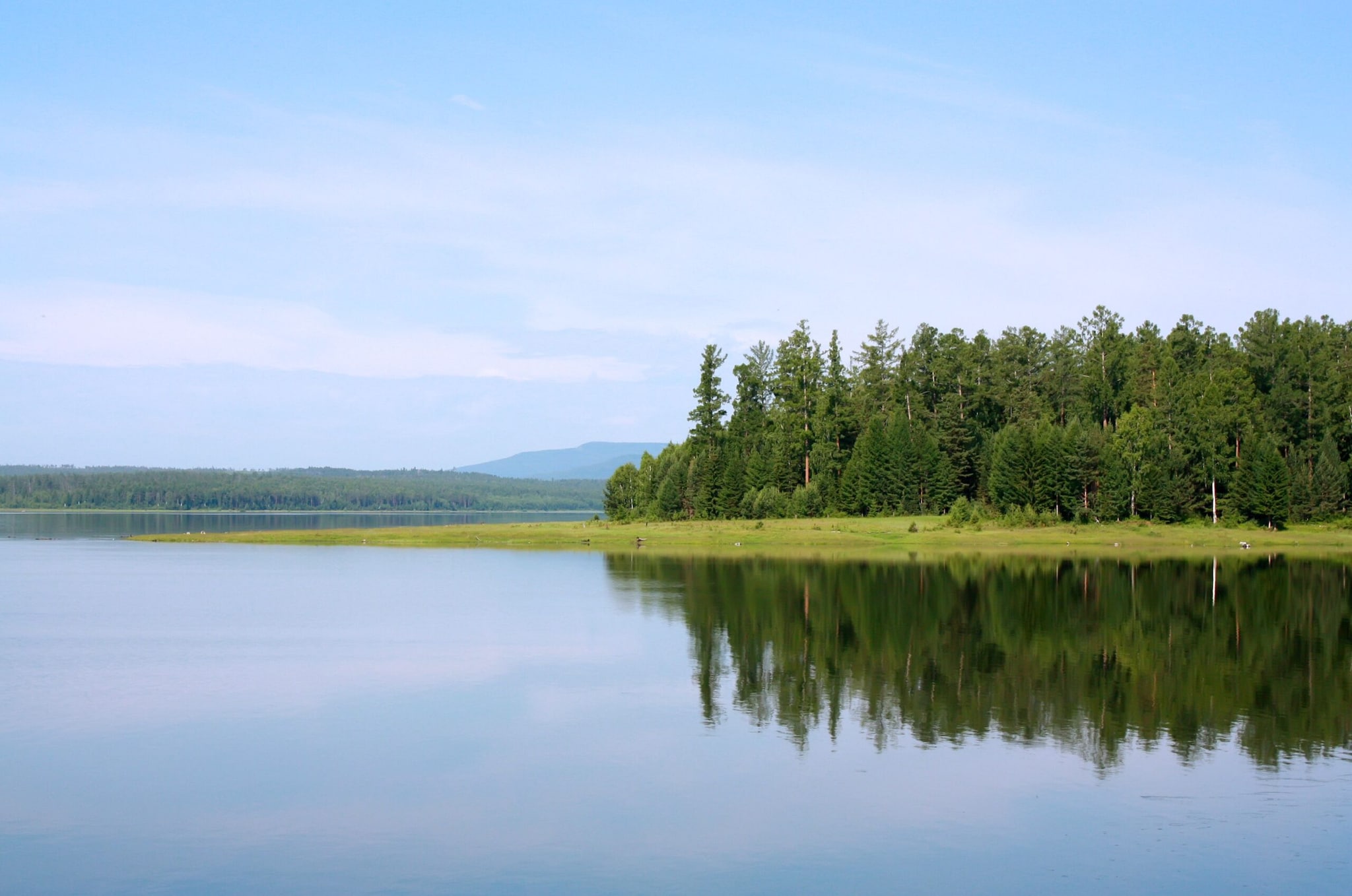 In northern Mongolia, Lake Khövsgöl offers forests, mountains and clear blue waters, quite a contrast to the arid landscapes of the Gobi. It is Mongolia's largest freshwater lake by volume and is surrounded by a region known for its natural beauty and traditional communities.