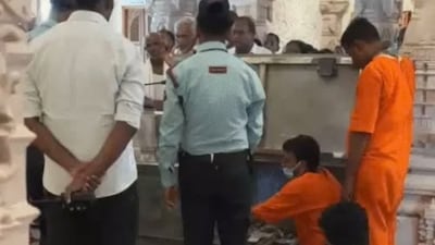 Employees involved in counting cash offerings will wear saffron jumpsuits without pockets.