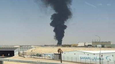 Large plume of black smoke rises from the fuel storage area at King Khalid International Airport, in Riyadh, Saudi Arabia. (IMAGE: REUTERS)