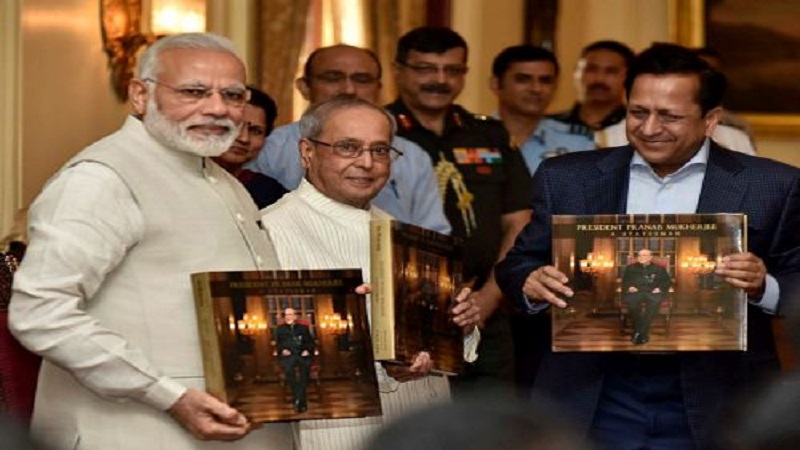 New Delhi: Prime Minister, Narendra Modi releasing the photo book titled President Pranab Mukherjee - A Statesman and presenting first copy to the President, Pranab Mukherjee, at Rashtrapati Bhawan, in New Delhi on Sunday. PTI Photo(PTI7_2_2017_000216B)