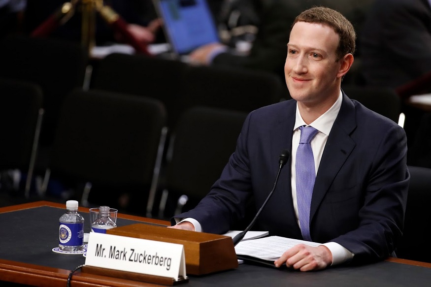 Facebook CEO Mark Zuckerberg smiles as he testifies before a joint hearing of the Commerce and Judiciary Committees on Capitol Hill in Washington, Tuesday, April 10, 2018, about the use of Facebook data to target American voters in the 2016 election. (AP Photo, Alex Brandon)
