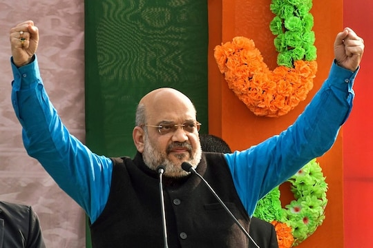 Malda: BJP National President Amit Shah addresses a rally, at Nitayapur in Malda, Tuesday, Jan 22, 2019. (PTI Photo) (PTI1_22_2019_000089B)