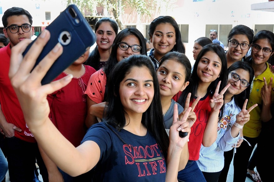 RPT WITH CORRECTION (Corrects dateline and content) ...Amritsar: Students take selfies as they celebrate their success after the declaration of Central Board of Secondary Education (CBSE)'s class 12th result, at a school in Amritsar on Saturday. (PTI Photo)(PTI5_26_2018_000066B)