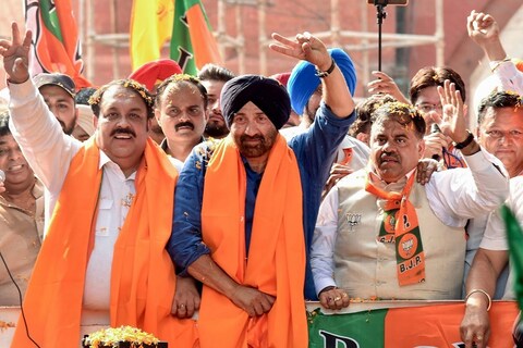 Amritsar: BJP's candidate from Gurdaspur Lok Sabha seat Sunny Deol, BJP State President Shwait Malik, BJP National Secretary Tarun Chugh with BJP-SAD supporters during an election roadshow in support of BJP candidate from Amritsar Hardeep Singh Puri ahead of the final phase of Lok Sabha polls, in Amritsar, Thursday, May 16, 2019. (PTI Photo) (PTI5_16_2019_000125B)