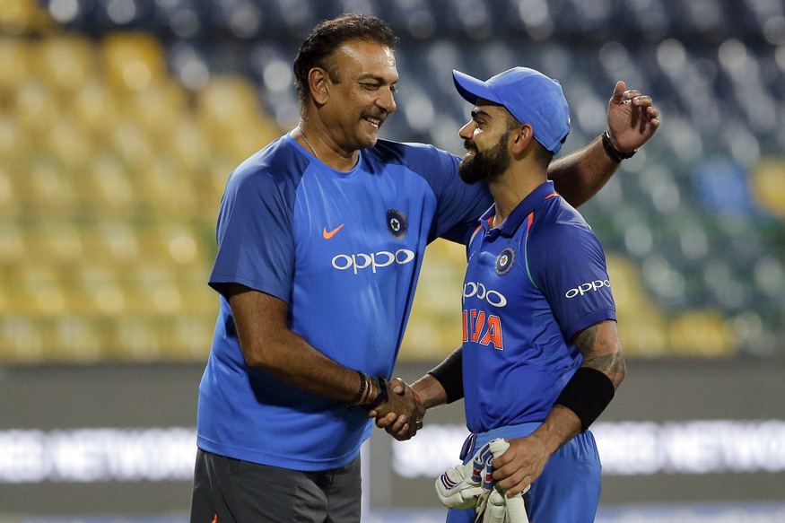 Indian team coach Ravi Shastri, left, congratulates captain Virat Kohli after their win over Sri Lanka in their fifth and last one-day international cricket match in Colombo, Sri Lanka, Sunday, Sept. 3, 2017. Indian won the match by six wickets. (AP Photo/Eranga Jayawardena)