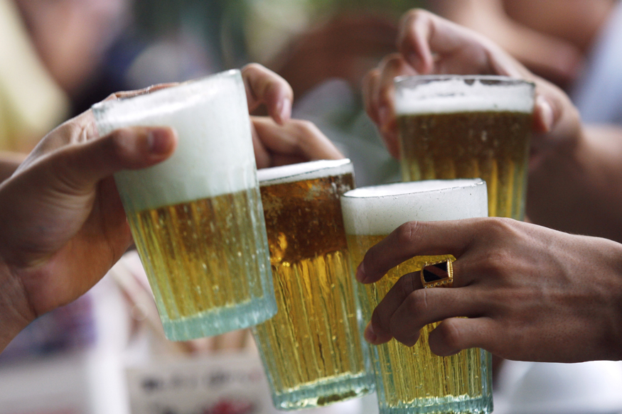 Men drink beer at a restaurant in Hanoi July 20, 2009. In smaller markets in Southeast Asia such as Singapore, Thailand and Vietnam, beer drinking is becoming a popular past time due to rising disposable income and relatively young populations who are embracing the party scene. Market research firm Euromonitor International says Asia is the most dynamic region globally in volume for beer, with average annual growth of 8 percent between 2003 and 2008. China is the world's biggest beer market and India's $12 billion alcohol market has been enjoying 12-15 percent annual growth. To match feature ALCOHOL/ASIA   REUTERS/Kham (VIETNAM FOOD SOCIETY) - RTR25USR