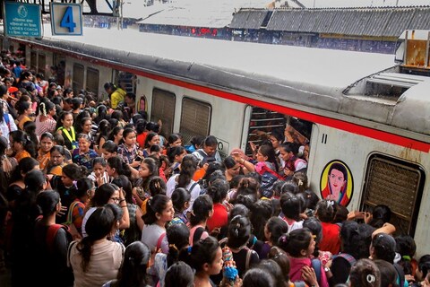 Thane: Passengers stranded at Thane railway station after heavy Monsoon rains hit the local train services, in Thane, Monday, July 8, 2019. (PTI Photo) (PTI7_8_2019_000104B)