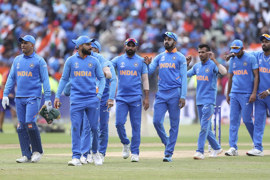 India's captain Virat Kohli, second left, and teammates leave the field after their win over Bangladesh in the Cricket World Cup match at Edgbaston in Birmingham, England, Tuesday, July 2, 2019. (AP Photo/Aijaz Rahi)