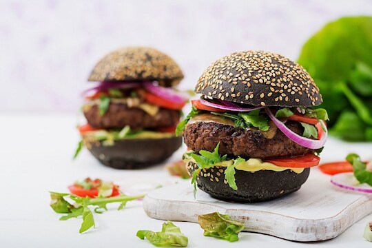 **EDS: WITH STORY DES 7** New Delhi: A charcoal burger on display in New Delhi. The popularity of charred foods, the acceptance of squid ink as more than a novelty ingredient, and the rise of activated charcoal as a health food has given a whole new concept of black food in the culinary industry. (PTI Photo) (PTI7_10_2019_000043B)
