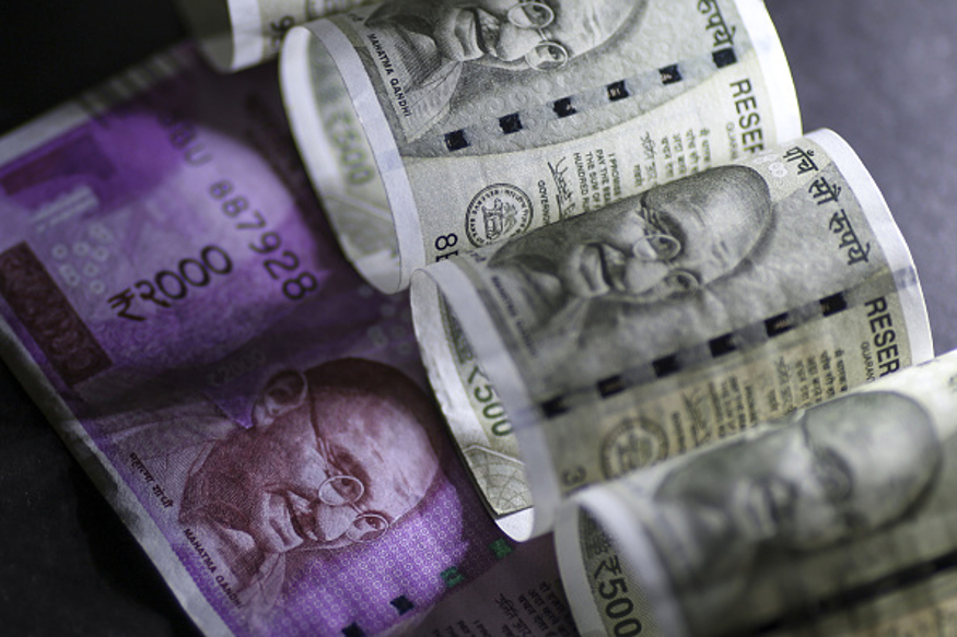 Indian two thousand and five hundred rupee banknotes are arranged for a photograph in Mumbai, India, on Sunday, Jan. 29, 2016. Reviving India's growth and boosting demand are essential as gross domestic product is likely to grow 7.1 percent in the year through March, the slowest pace in three years -- and this is before considering the impact of currency shortages in an economy where 98 percent of consumer payments are made in cash. Photographer: Dhiraj Singh/Bloomberg