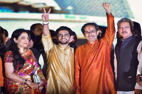 Mumbai: Newly sworn-in Chief Minister of Maharashtra Uddhav Thackeray, his son and Yuva Sena Chief Aaditya Thackeray acknowledge their supporters, at Shivaji Park in Mumbai, Thursday, Nov. 28, 2019. (PTI Photo/Mitesh Bhuvad) (PTI11_28_2019_000205B)