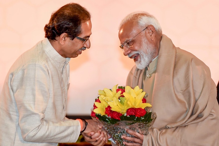 New Delhi: Prime Minister Narendra Modi being felicitated by Shiv Sena chief Uddhav Thackeray during a dinner meeting with National Democratic Alliance leaders in New Delhi, Tuesday, May 21, 2019, two days ahead of Lok Sabha polls results. (PTI Photo/Kamal Singh) (PTI5_21_2019_000171B)