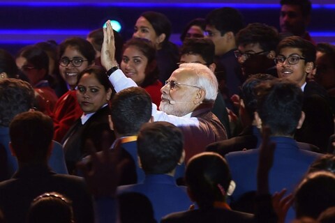 Delhi: Prime Minister Narendra Modi waves as he arrives for an interactive session-'Pariksha Par Charcha' with school and college students at Talkatora Stadium in New Delhi, on Friday. PTI Photo by Manvender Vashist (PTI2_16_2018_000170B)