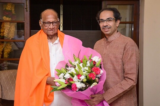 Mumbai: Maharashtra Chief Minister Uddhav Thackeray greets Nationalist Congress Party (NCP) President Sharad Pawar on his 79th birthday, in Mumbai, Thursday, Dec. 12, 2019. (PTI Photo)(PTI12_12_2019_000311B)