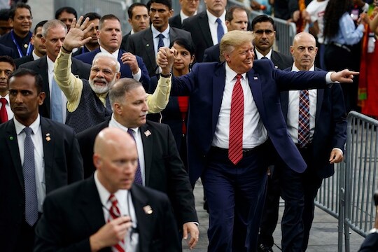 Houston: President Donald Trump and Indian Prime Minister Narendra Modi walk around NRG Stadium waving to the crowd during the "Howdy Modi: Shared Dreams, Bright Futures" event, Sunday, Sept. 22, 2019, in Houston. AP/PTI Photo(AP9_23_2019_000011B)