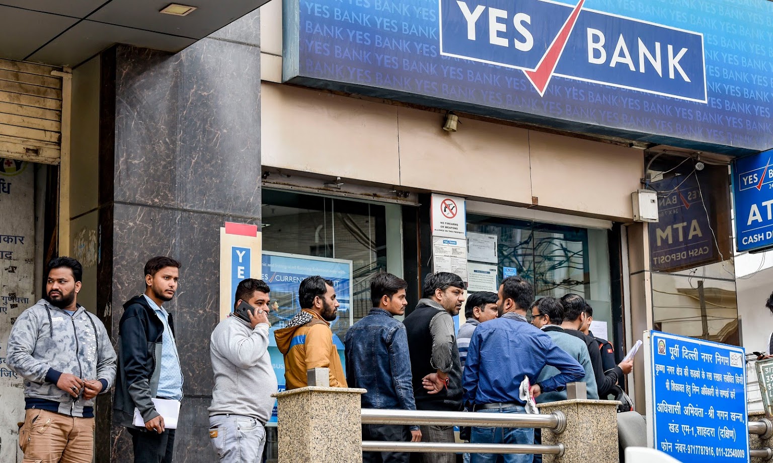 Noida: Account holders stand in a queue to withdraw money from YES Bank, at Krishna Nagar in New Delhi, Saturday, March 7, 2020. The central bank on Thursday imposed a moratorium on the capital-starved Yes Bank, capping withdrawals at Rs 50,000 per account and superseded the board of the private sector lender with immediate effect. (PTI Photo/Ravi Choudhary)(PTI07-03-2020_000036B)