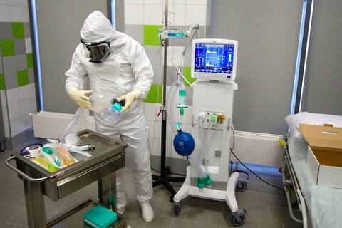 An employee prepares emergency medical care for patients with suspected coronavirus infection in the Illinsky hospital in Krasnogorsk, outside Moscow, Russia, Thursday, March 26, 2020. The new coronavirus causes mild or moderate symptoms for most people, but for some, especially older adults and people with existing health problems, it can cause more severe illness or death. (Sergey Vedyashkin, Moscow News Agency photo via AP)