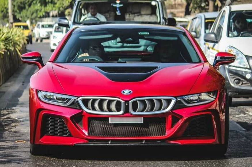 modified BMW i8. (फोटो सौजन्य : Darshan Shinde Photography) बीएमडब्ल्यू आय8 ही स्पोर्ट्स कार सचिनसाठी खास कस्टमाईज्ड करण्यात आली होती. सचिन स्वतः 2012 पासून BMW चा ब्रँड अँबॅसेडर आहे. या मॉडिफाईड गाडीचा रंगसुद्धा खास सचिनला हवा म्हणू लाल आणि पांढरा रंगवण्यात आला होता. modified BMW i8. (फोटो सौजन्य : Darshan Shinde Photography) बीएमडब्ल्यू आय8 ही स्पोर्ट्स कार सचिनसाठी खास कस्टमाईज्ड करण्यात आली होती. सचिन स्वतः 2012 पासून BMW चा ब्रँड अँबॅसेडर आहे. या मॉडिफाईड गाडीचा रंगसुद्धा खास सचिनला हवा म्हणू लाल आणि पांढरा रंगवण्यात आला होता.