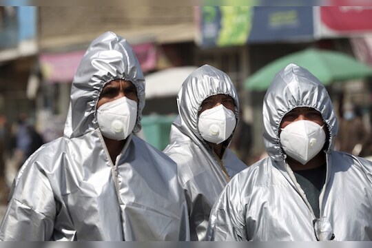 Volunteers in protective suits to help curb the spread of the coronavirus prepare to disinfect public areas in Kabul, Afghanistan, Wednesday, April 8, 2020. The new coronavirus causes mild or moderate symptoms for most people, but for some, especially older adults and people with existing health problems, it can cause more severe illness or death. (AP Photo/Rahmat Gul)