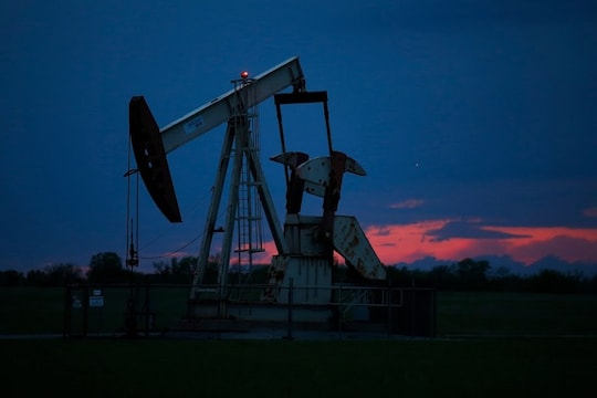 A pumpjack is pictured as the sun sets Tuesday, April 21, 2020, in Oklahoma City. Oil prices continue to drop, because very few people are flying or driving, and factories have shut amid widespread stay-at-home orders due to coronavirus concerns. (AP Photo/Sue Ogrocki)