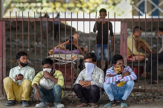 Mumbai:  Stranded migrant workers take shelter under a flyover next to the railway tracks near the Lokmanya Tilak Terminus, during the complete lockdown imposed to contain the coronavirus pandemic, in Mumbai, Tuesday, March 31, 2020. (PTI Photo/Kunal Patil) (PTI31-03-2020_000069B)