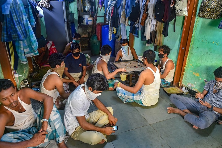 Mumbai: Labourers play carrom during a nationwide lockdown in the wake of coronavirus pandemic, at Kamathipura area in Mumbai, Sunday, March 29, 2020. (PTI Photo/Mitesh Bhuvad)(PTI29-03-2020_000072B)