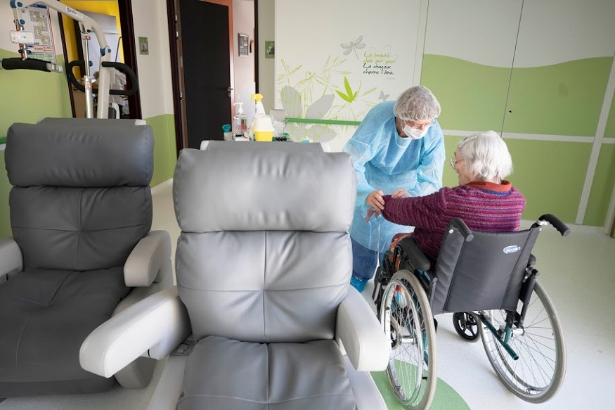 A medical staff tests a resident with Covid-19 in a nursing home in Bergheim, eastern France, Tuesday April 14, 2020. Amid growing public concern about the virus spreading unchecked in nursing homes, French authorities have stepped up testing and started counting virus deaths in facilities for the elderly. The new coronavirus causes mild or moderate symptoms for most people, but for some, especially older adults and people with existing health problems, it can cause more severe illness or death. (AP Photo/Jean-Francois Badias)