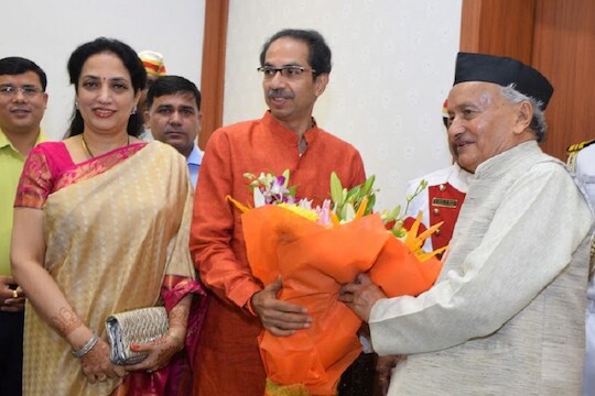 Mumbai: Maharashtra Governor Bhagat Singh Koshyari receives a bouquet from state Chief Minister-designate Uddhav Thackeray and his wife Rashmi Thackeray, at Raj Bhavan in Mumbai, Wednesday, Nov. 27, 2019. (PTI Photo) (PTI11_27_2019_000048B)