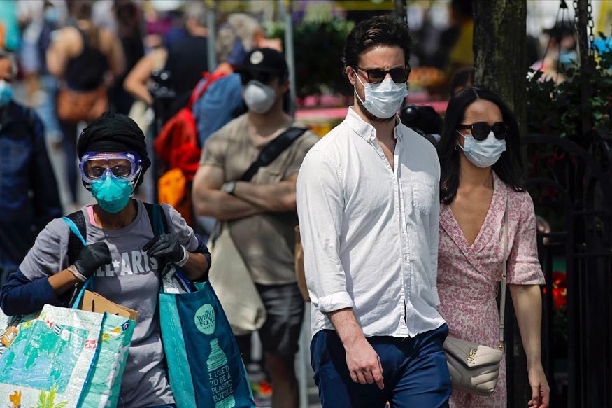 People leave the Union Square Green Market Saturday, May 2, 2020, in New York. (AP Photo/Frank Franklin II)