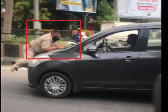 धक्कादायक! लॉकडाऊनमध्ये अडवलं म्हणून पोलीस अधिकाऱ्याला फरफटत नेलं, पाहा VIDEO