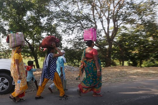 Migrant workers families walk on foot attempting to reach their native villages in Mumbai, India, Saturday, May 9, 2020.  Locking down the country's 1.3 billion people has slowed down the spread of the virus, but has come at the enormous cost of upending lives and millions of lost jobs. (AP Photo/Rajanish Kakade)