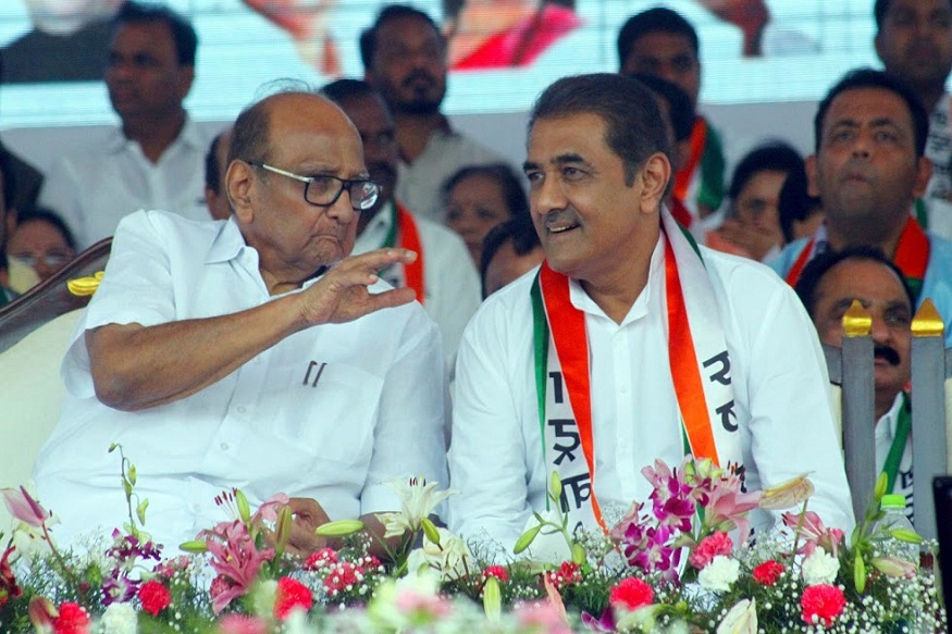 Pune: Nationalist Congress Party (NCP) chief Sharad Pawar with party leader Praful Patel at the party's Halla Bol Yatra rally in Pune on Sunday, June 10, 2018. (PTI Photo) (PTI6_10_2018_000194B)