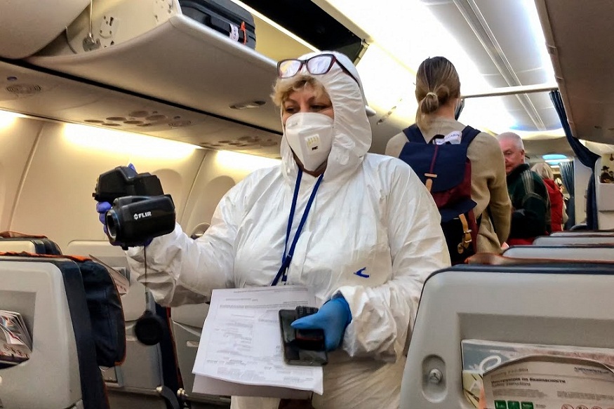 Moscow: A Russian medical expert checks passengers arriving from Italy inside the plane at Sheremetyevo airport outside Moscow, Russia, Sunday, March 8, 2020. The Russian authorities have ordered mandatory medical checks upon arrival for all those who arrive from countries with high a level of coronavirus cases and ordered them to stay home for two weeks. AP/PTI(AP09-03-2020_000039B)