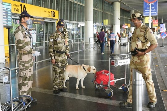 Kolkata: Central Industrial Security Force (CISF) jawans check an unattended baggage at NSCBI Airport amid coronavirus pandemic, in Kolkata , Saturday, March 21, 2020. Novel coronavirus cases in India rose to 258 on Saturday after 35 fresh cases were reported in various parts of the country. (PTI Photo/Ashok Bhaumik)(PTI21-03-2020_000028B)