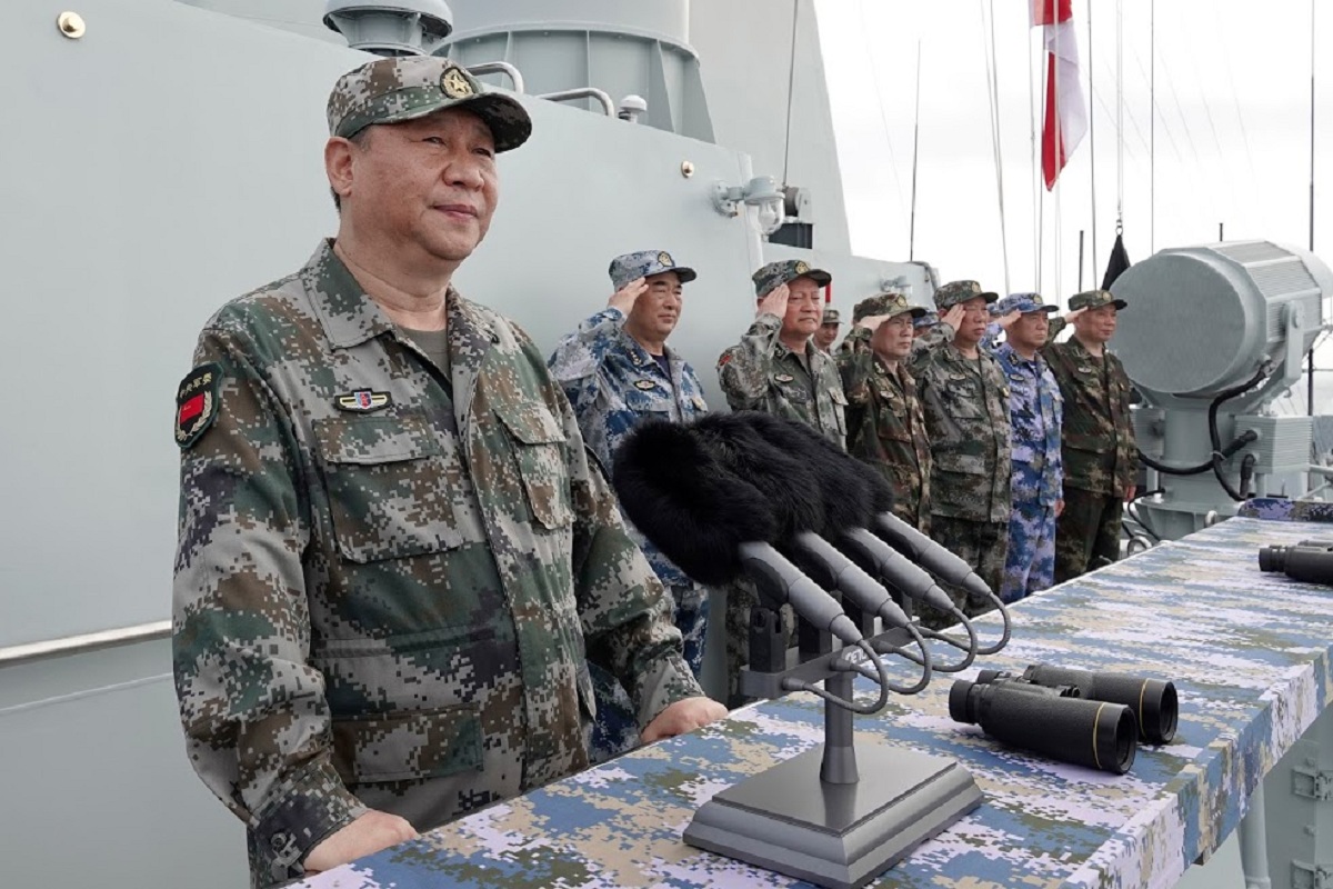 FILE - In this April 12, 2018, file photo released by Xinhua News Agency, Chinese President Xi Jinping speaks after reviewing the Chinese People's Liberation Army (PLA) Navy fleet in the South China Sea. A new Pentagon report lays out U.S. concerns about China's growing military might, underscoring worries about a possible attack against Taiwan. The report's release on Jan. 15, 2019 came just a week after Chinese President Xi Jinping called on his People's Liberation Army to better prepare for combat. (Li Gang/Xinhua via AP, File)