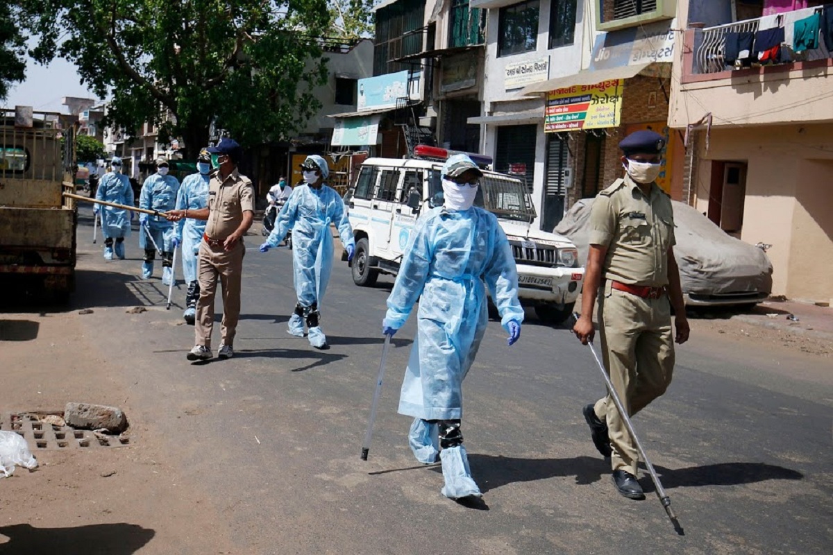 Ahmedabad: Security personnel wearing protective gear patrol a street, during a nationwide lockdown to slow the spreading of coronavirus, in Ahmedabad, Thursday, May 07, 2020. (PTI Photo) (PTI07-05-2020_000127B)
