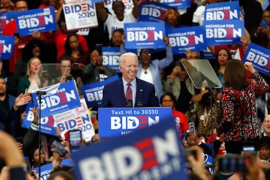 FILE - In this March 9, 2020, file photo Democratic presidential candidate former Vice President Joe Biden speaks during a campaign rally at Renaissance High School in Detroit. Given Biden’s uneven performance as a campaigner throughout the Democratic primary, some in the party are content to have the former vice president keeping a lower profile for now, though they know it’s not a dynamic that can sustain itself as Election Day draws closer.  (AP Photo/Paul Sancya, File)