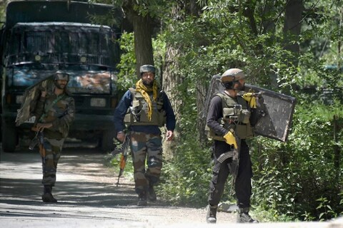 Pulwama: Army soldiers during an encounter with militants at Beighpora area in Pulwama district of South Kashmir, Wednesday, May 6, 2020. Commander-in-Chief of Hizbul Mujahideen Riyaz Naikoo and three other militants were killed in two different operations by security forces. (PTI Photo/S. Irfan)(PTI06-05-2020_000087B)