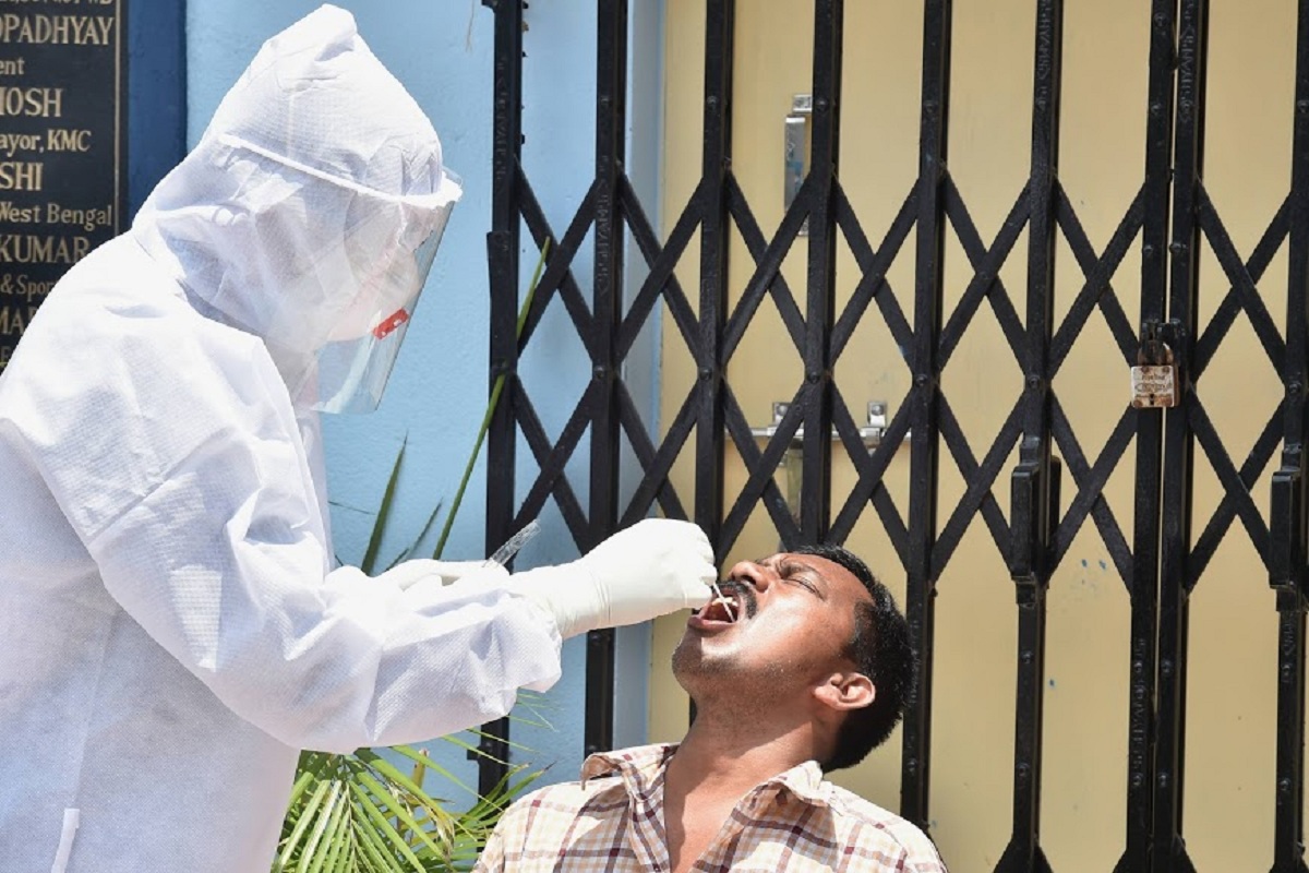 Kolkata: A medic takes sample from a patient showing cough and fever symptoms for COVID-19 test, during ongoing lockdown, in Kolkata, Friday, May 8, 2020. (PTI Photo/Swapan Mahapatra) (PTI08-05-2020_000071B)