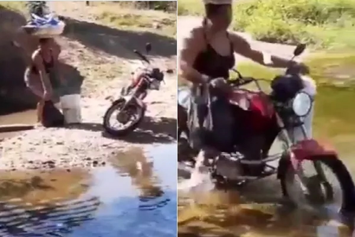 डोक्यावर टब, हातात बादली; बाईकला किक मारून पाण्यातून चालली ही नार; पाहा VIDEO