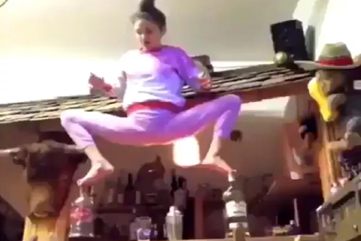 टेबलावर 2 काचेच्या बाटल्या, त्यावर पाय ठेवून महिलेचा योगा; पुढे जे घडलं ते पाहून चुकेल काळजाचा ठोका