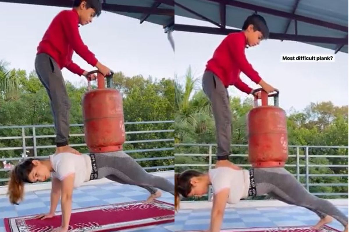 लेडी बाहुबली! पाठीवर सिलेंडर आणि मुलाला घेत महिलेचं Exercise; VIDEO होतोय व्हायरल