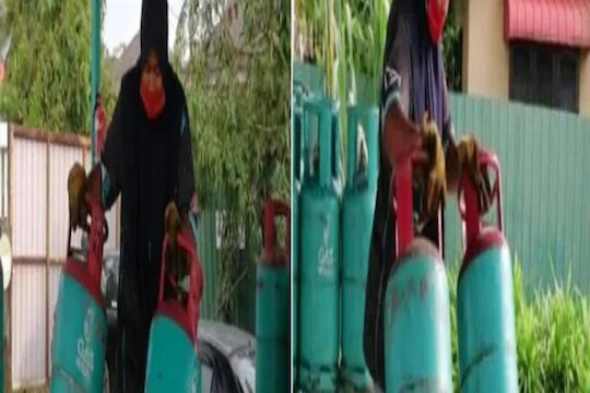 OMG! ही तर 'लेडी बाहुबली'; एकाच वेळी तब्बल 4-4 Gas Cylinder उचलते एकटी महिला