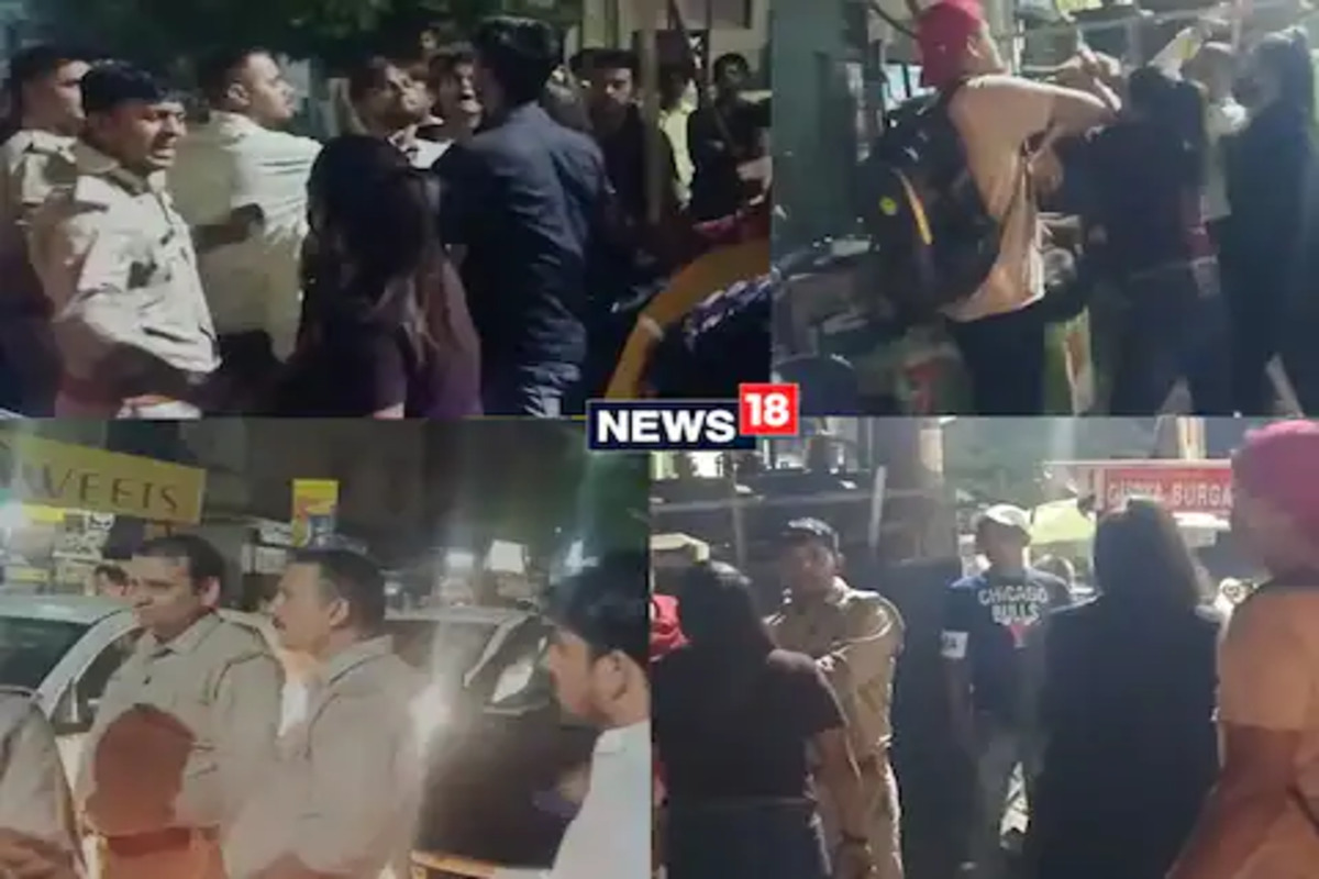 VIDEO : पोलिसांच्या समोरच दोन तरुणींची दबंगगिरी, तरुणाला धो-धो धुतले