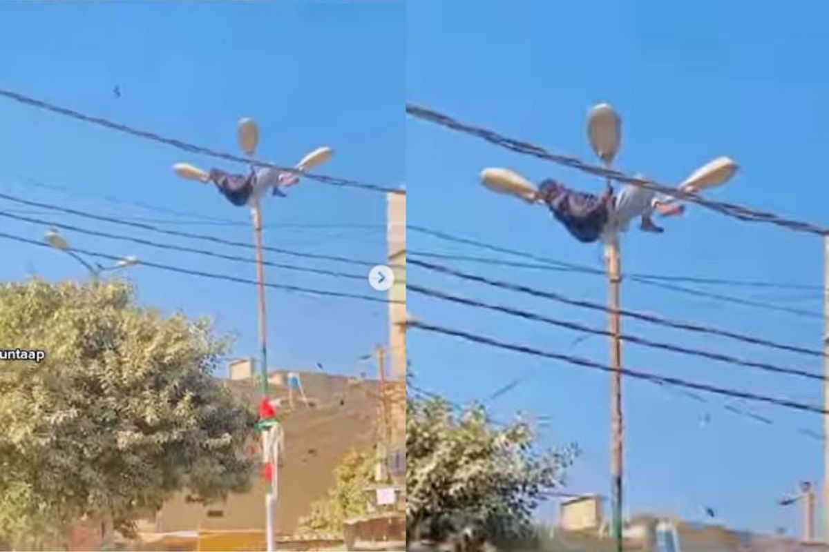 विजेच्या उंच खांबावर चढून तिथेच झोपला