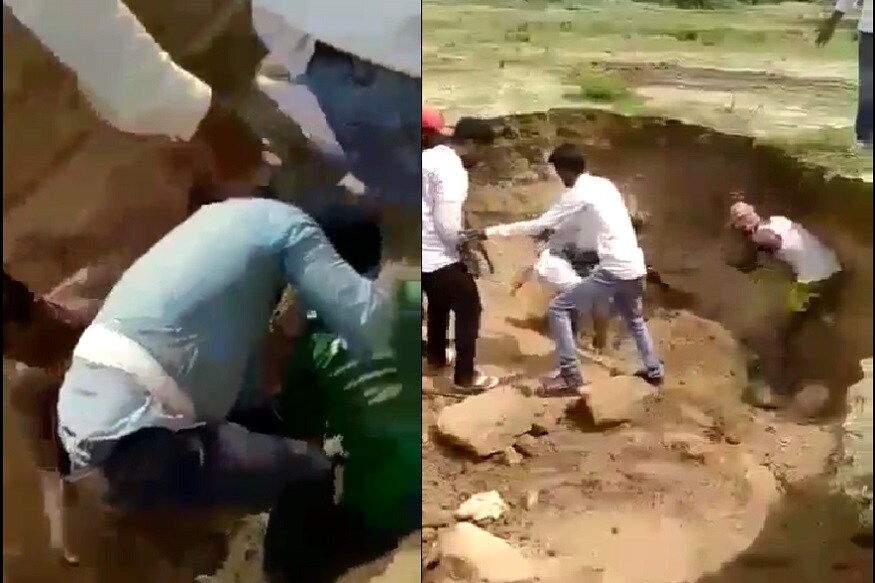 Villagers saving man trapped in mudslide at Yadagiri