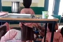 ക്ലാസ് മുറിയിൽ അധ്യാപികയുടെ സുഖനിദ്ര; ബുക്ക് വിശറിയാക്കി കുട്ടികൾ; വീഡിയോ വൈറൽ