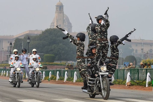 BSF 'Daredevils' motorcycle stunt team during the rehearsals for the upcoming Republic Day parade at Rajpath in New Delhi on Monday. (PTI)